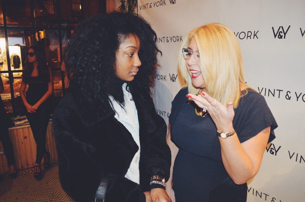 Fashion Editor Telsha Anderson talking to owner Larisa Ginzburg